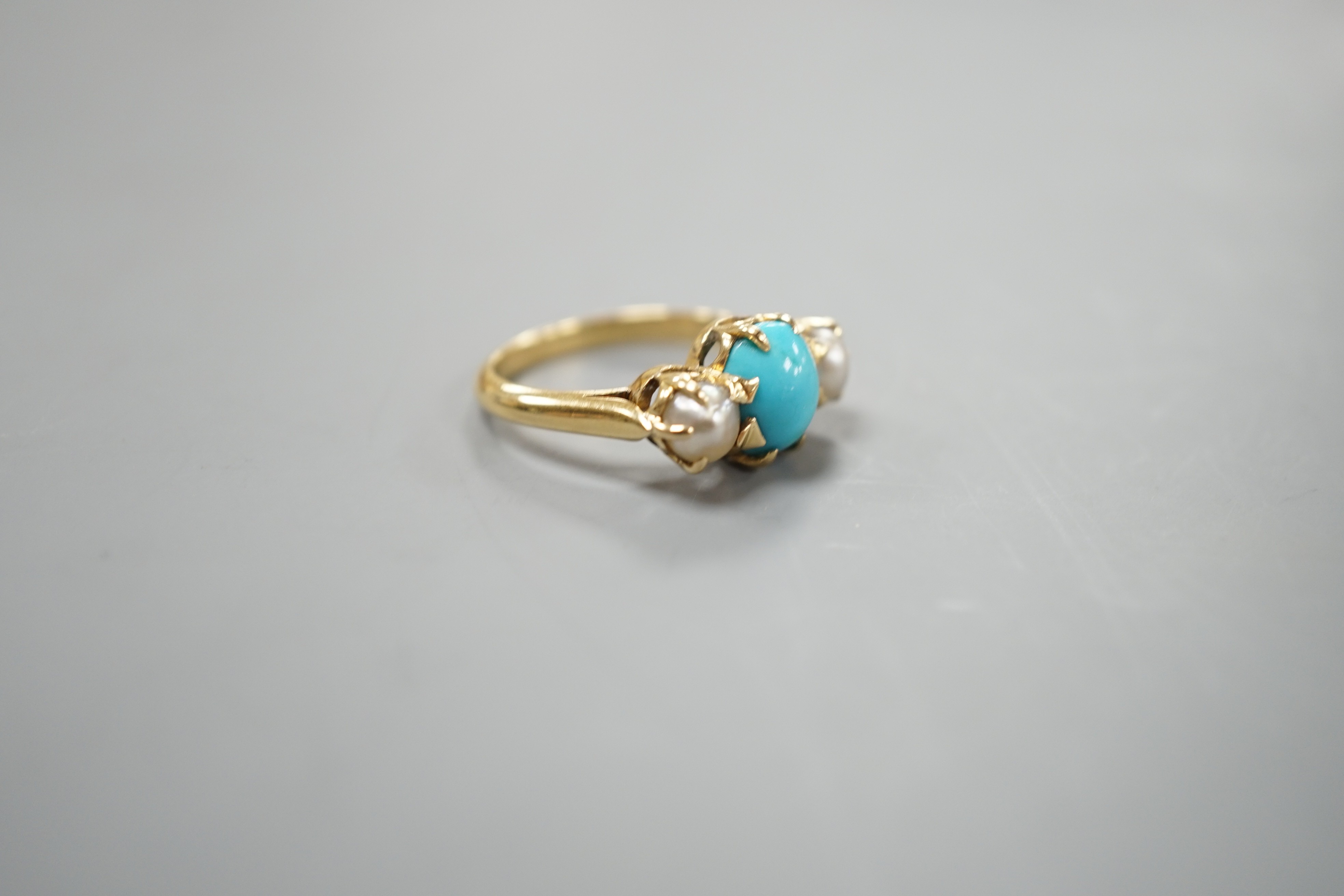 A yellow metal, turquoise and split pearl set three stone ring, size L, gross weight 4.8 grams.